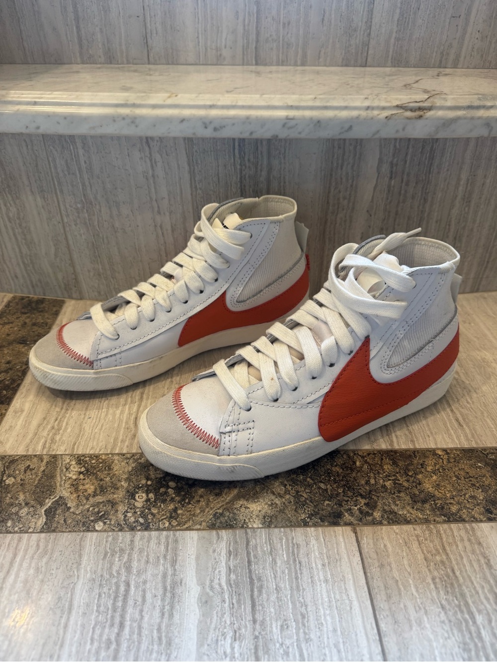 Nike Men’s White High-Top Sneakers with Orange Swoosh